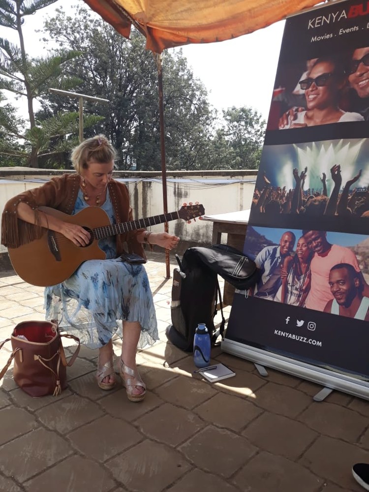 Anouschka performing acoustically at a KenyaBuzz rooftop session